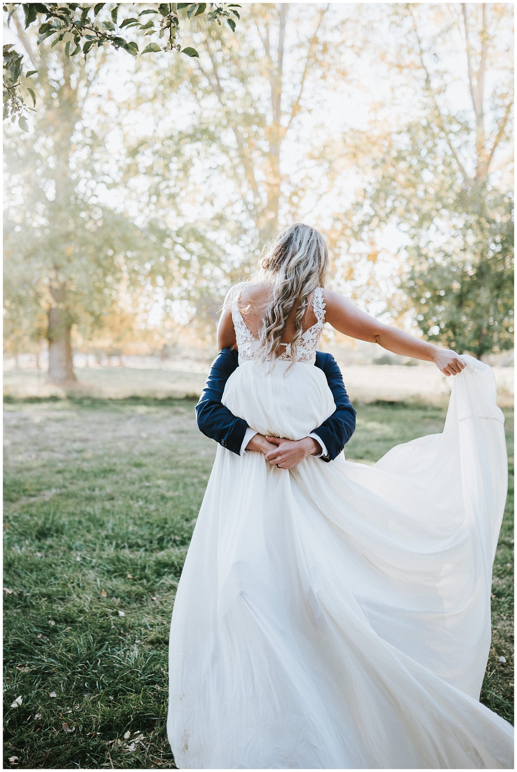 boho-bride-and-groom-long-wedding-dress-with-train-bride-and-groom-flowy-wedding-dress-fall-wedding-twin-falls-idaho-wedding-photographer-finch-film-and-photo