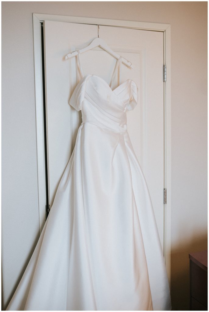 simple luxurious wedding dress with off the shoulder sleeves from margenes bridal