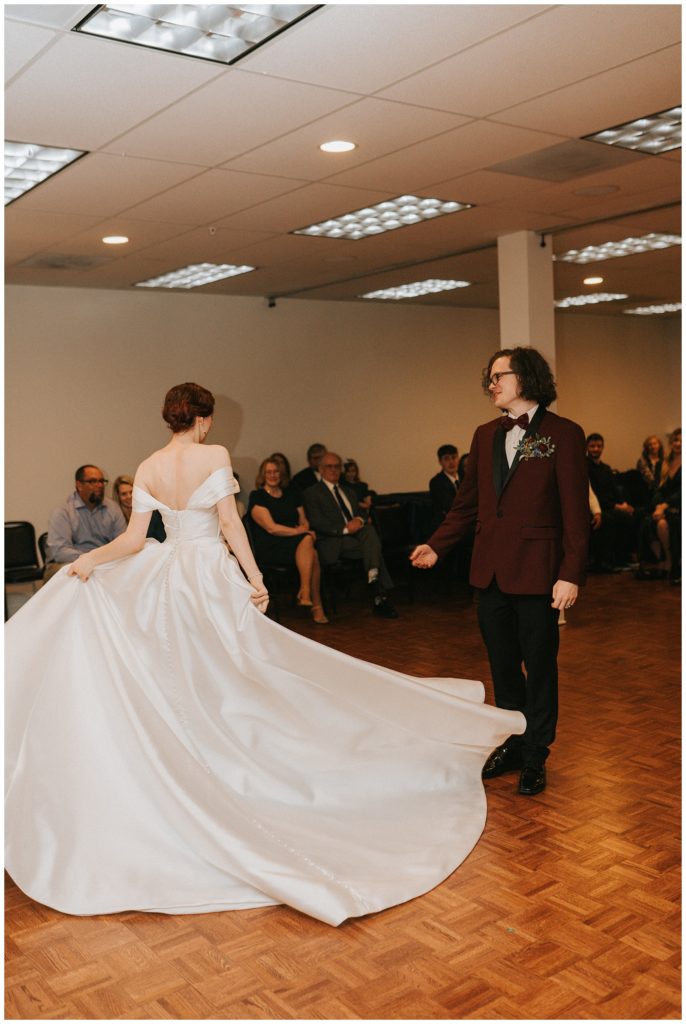 bride swings her ballgown dress during first dance