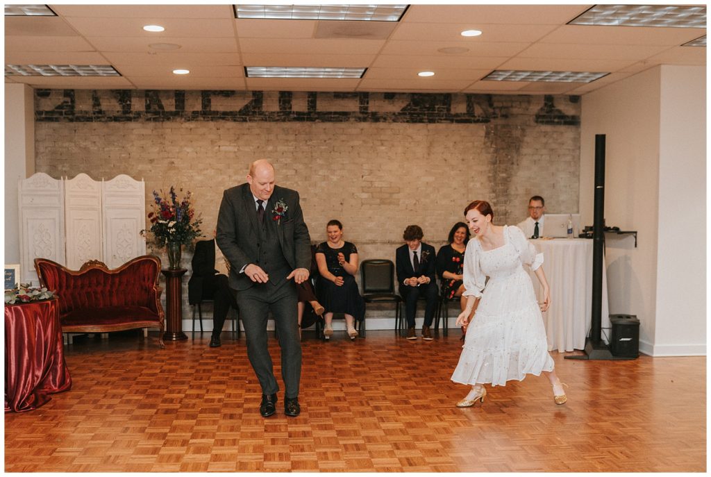 bride and her dad exchange a fun dance