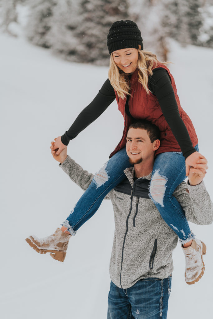 bride on groom's shoulders, fun engagement session poses, twin falls wedding photographer