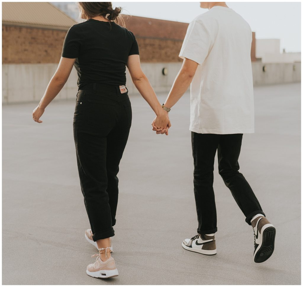 trendy rooftop engagement session, matching nike shoes
